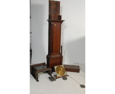 A 19th century Georgian brass faced longcase clock having spandrel embellishments to the corners. The grandfather clock has c