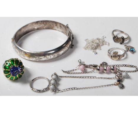 A group of contemporary silver and other jewellery to include a hinged bangle with engraved decoration (hallmarked Birmingham