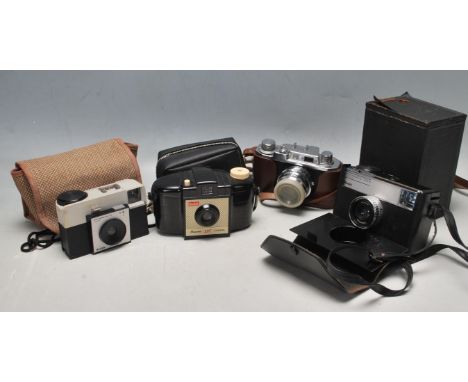 A collection of vintage 20th century cameras to include Box Brownie, Halina 35x, Kodak Instamatic 233X, Kodak Brownie 127 and
