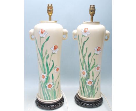 A large pair of 20th century believed 1930’s Chinese oriental ceramic table lamps of a baluster form with enamelled floral mo