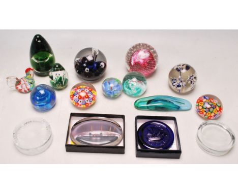 A collection of vintage 20th century studio art glass paperweights of various form and sizes to include Wedgwood, Eirian, Mil