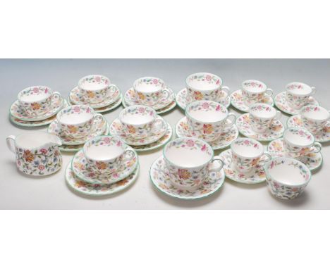 An antique Minton Haddon hall fine bone china comprising of tea set comprising of six coffee cups and saucers, 3 large large 