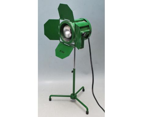 A vintage 20th century desk lamp in a shape of miniature theatre light having four folding light deflectors adjustable light 