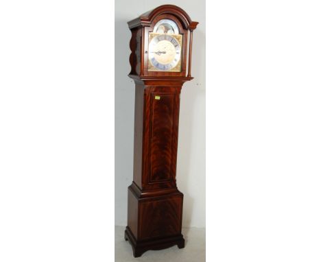 A modern eight-day mahogany longcase grandfather clock by Comitti of London. The clock having a silvered and brassed 30cm dia