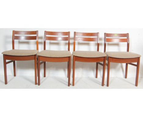 A set of four vintage 20th century Danish inspired teak wood frame dining chairs having ladder backrest, checked upholstery s