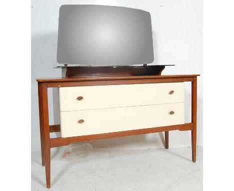 A vintage 20th century teak wood dressing table with shaped adjustable mirror atop, black glass floating shelf above two long