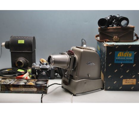 A collection of vintage 20th century slide projector and film projectors to include an Aldis colour slide projector, OMO 16mm