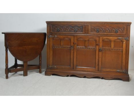A 20th century antique style Jacobean Revival&nbsp; oak sideboard / dresser base in the manner of Old Charm / Jaycee having a