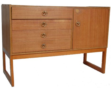 A vintage 1980’s melamine sideboard credenza of small proportions having four drawers to the left and cupboard to the right w