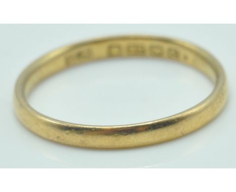A 22ct gold hallmarked band ring. Birmingham hallmarked for 1927, sponsors marks HS. Total weight 2.0g / Size M.5 .