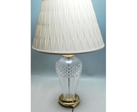 A contemporary Waterford Crystal made decorative glass table lamp and shade. The shade of typical form, with a large bulbous 