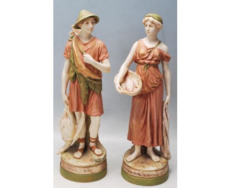 A pair of 20th Century Royal Dux Czechoslovakian ceramic figurines to include a hunter with a quiver of arrows and duck and a