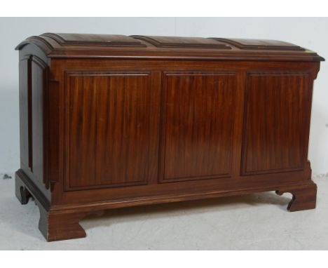A good large antique Victorian style mahogany domed top trunk / blanket box / storage chest having a brassed hinged cover wit