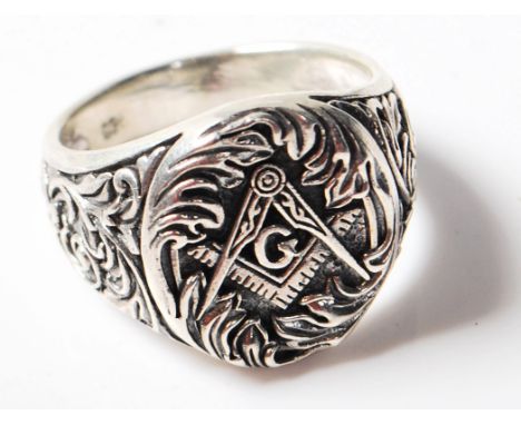 A stamped .925 silver masonic style ring featuring the iconic square and compass. Size V.&nbsp; Gross weight 8.6g