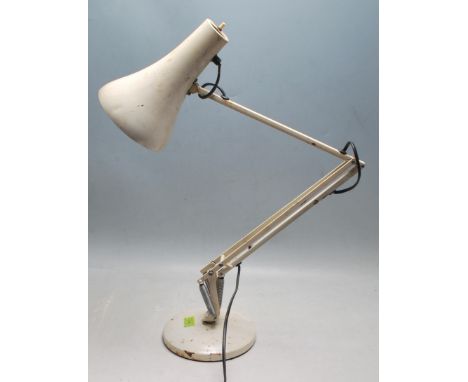 A vintage 20th Century Herbert Terry Anglepoise industrial desk lamp finished in a white enamel colourway. Raised on circular