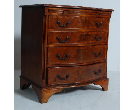 A regency revival mahogany serpentine fronted bachelors chest of drawers / bedside chests of drawers being raised on bracket 