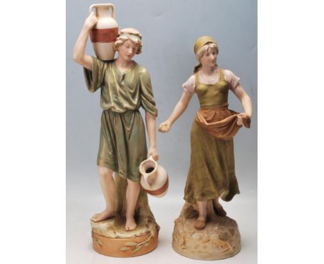 Two 20th Century Royal Dux Czechoslovakian ceramic figurines to include a female figure holding seeds in her skirts (no. 2239