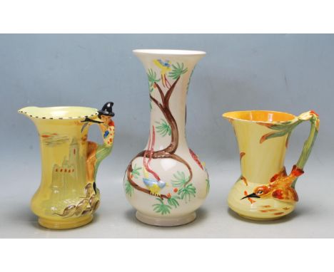 A group of three late 20th century ceramic pottery comprising of a Charlotte Rhead Crown Ducal vase having polychrome floral 