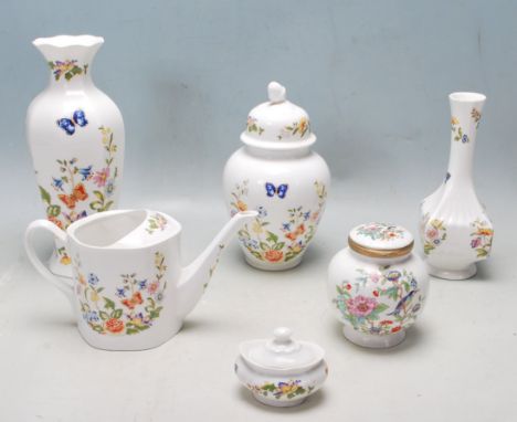 A collection of vintage 20th century Aynsley fine bone china ceramic ware to include vases, lidded pots, water pot, etc. All 