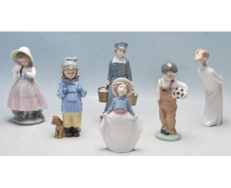A collection of vintage late 20th century figurines by Nao / Lladro comprising of a boy with a football, lady with pails of m