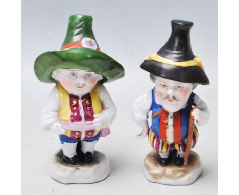 A pair of Edme Samson of Paris 19th Century antique ceramic dwarves, imitations of Derby mansion house dwarf examples, each b