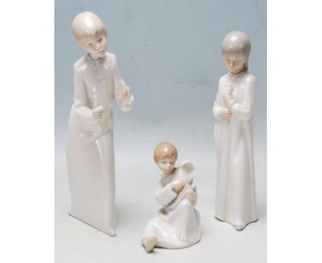 A group of three vintage 20th century ceramic porcelain Spanish Valencian figurines to include two NAO children figurine, sta