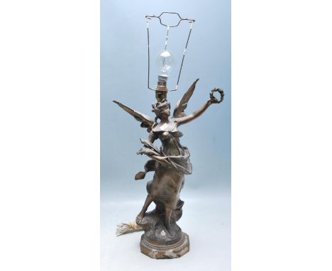 A late 19th century French “ La Victoire “ gilt wood and plaster table lamp statue having grass light fitting to the top and 