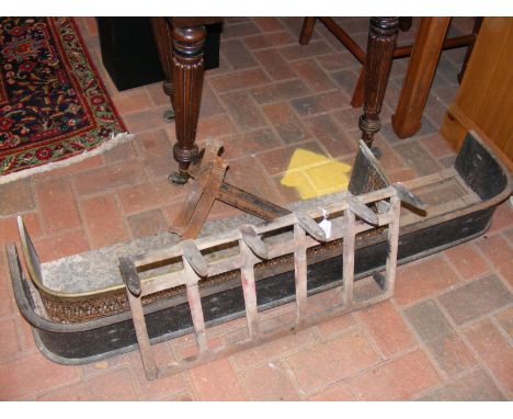 Two fire fenders, a pair of fire dogs and a fire grate 