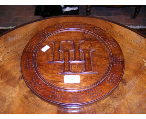 A handmade circular wooden cribbage board with carved monogrammed centre - 29cm diameter
