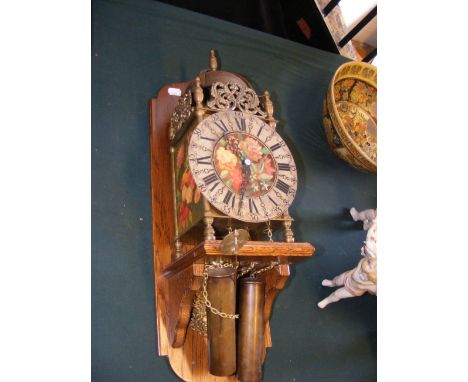 A brass lantern clock with painted still life flower scene to dial  CONDITION REPORT Our team of trusted experts are on hand 