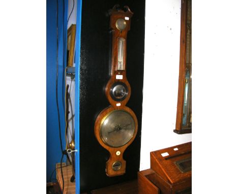 An antique barometer/thermometer with silvered dial