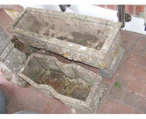 A concrete garden trough on plinths, together with one other trough 