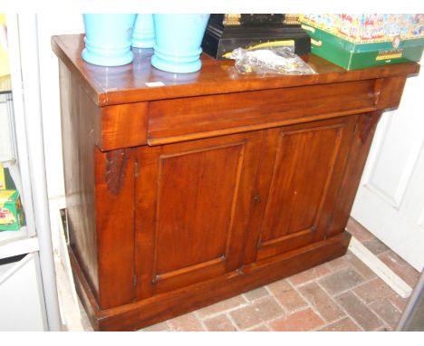 An antique mahogany chiffonier
