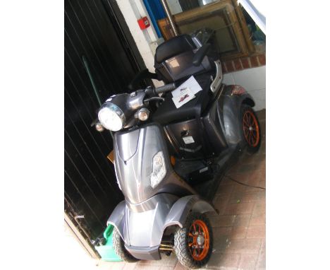 A Green Power mobility scooter -  model 'Fastest' CONDITION REPORTrequires new battery