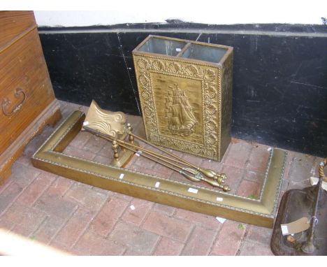 A brass fire fender, irons etc.