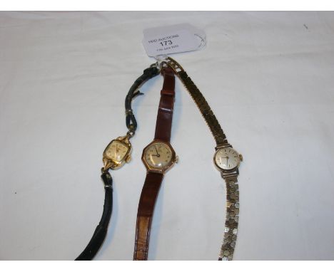 A ladies vintage 9ct Tissot wrist watch together with two others