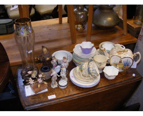 An Art Deco crinoline lady teaset, Shelley teacups, continental figurines, Art Deco glass vase, etc.  