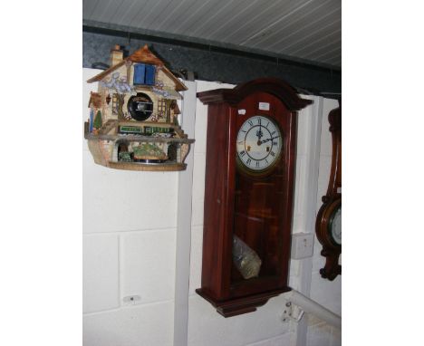 A 'Flying Scotsman' cuckoo clock, together with a reproduction Lincoln 31 Day wall clock  CONDITION REPORT Our team of truste