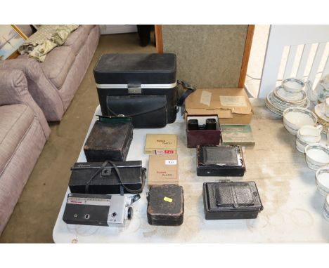 A collection of various cameras to include a Canon Cine Canonet, a Viewmaster stereoscope, various accessories to include Kod