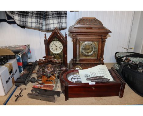 A three hole mantel clock; a mahogany cased single hole mantel clock; a cuckoo clock and a reproduction mahogany cased wall c