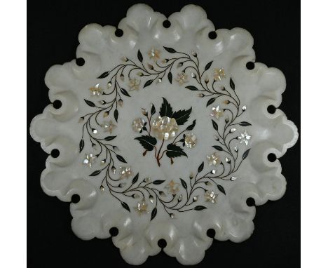 An Indian alabaster shaped circular table-top, inlaid in mother-of-pearl and coloured specimen stones with flowering stems, 3
