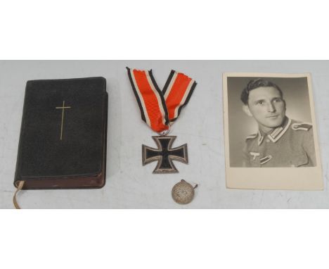 A WWII German soldier's memory box, old cigar box with an original three part constructed iron cross 2nd class, photo, button