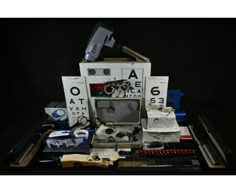 Ophthalmology - a comprehensive collection of optician's equipment, including a wall mounted Snellen chart light box, 34cm x 