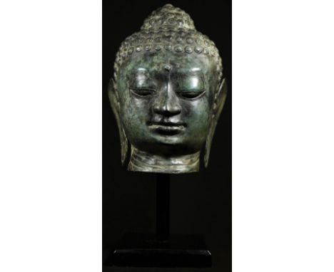 A Chinese sculpture, after an ancient bronze, head of Buddha, square plinth, 41cm high 