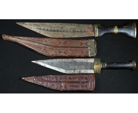 A Somali billao dagger, 16.5cm blade, hardwood grip, tooled leather scabbard, 28.5cm long overall; another, 36cm long overall