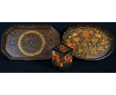 A Kashmiri papier mâché rectangular playing card box, typically decorated with flowers, 8cm high; an oval tray, similar, 23cm