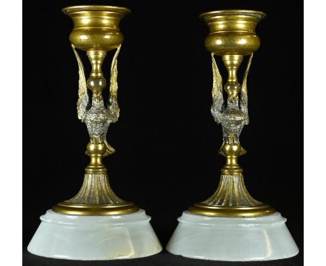 A pair of 19th century French gilt bronze candlesticks, each as a bird, white onyx bases, 13cm high, c.1870 