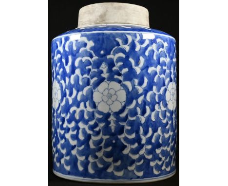 A large Chinese blue and white cylindrical jar, painted in underglaze blue with flowerheads and foliage, 30cm high, six-chara