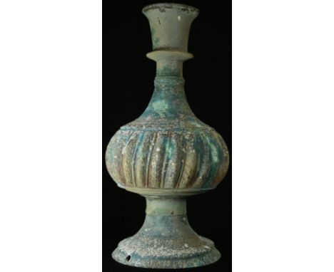 A Middle Eastern hookah base, verdigris patination, fluted and engraved, 28cm high, drilled as a lamp base 
