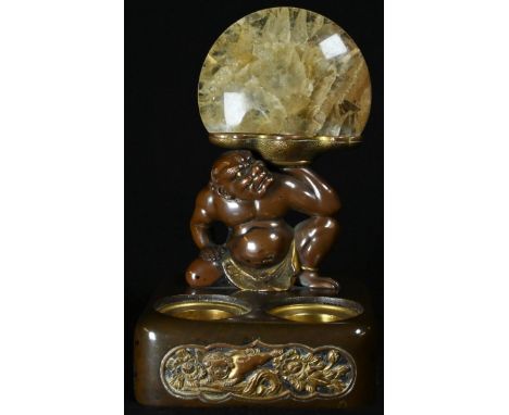 A Japanese bronze novelty two-section inkwell, mounted with a demonic sumo supporting a fluorspar demi-lune, 13cm high 